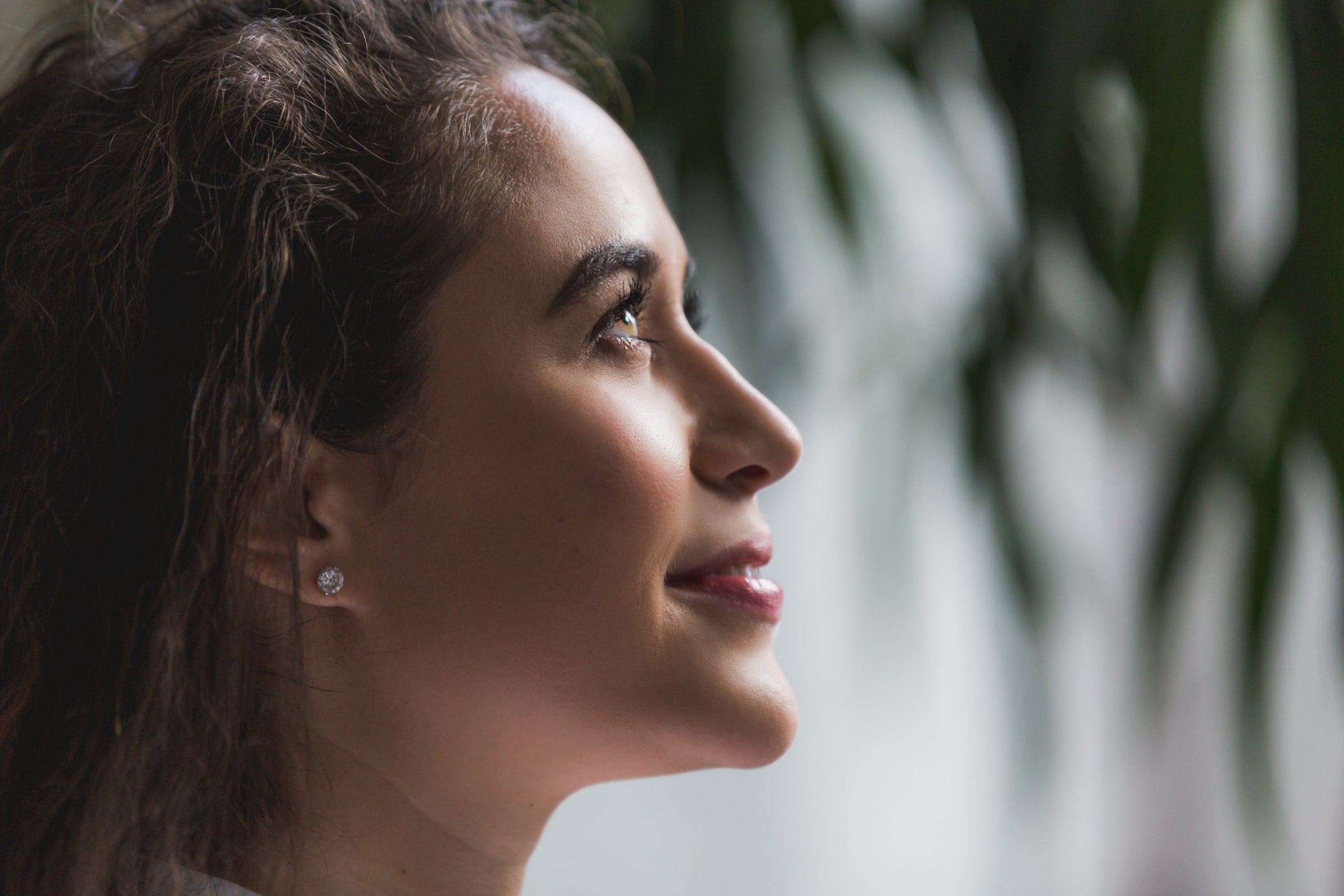 Woman with Beautiful Skin looking up and smiling