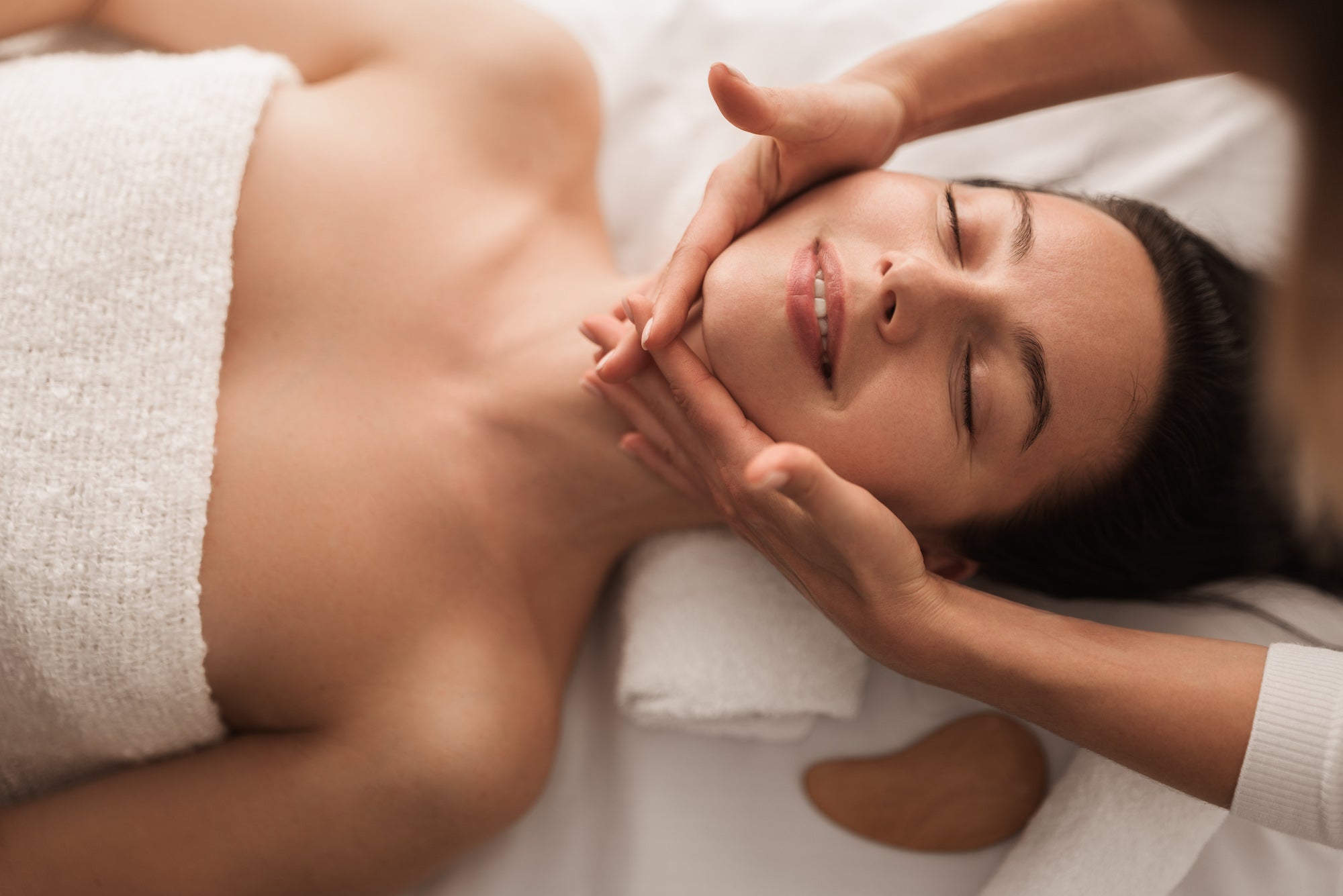 Woman receiving a luxurious facial